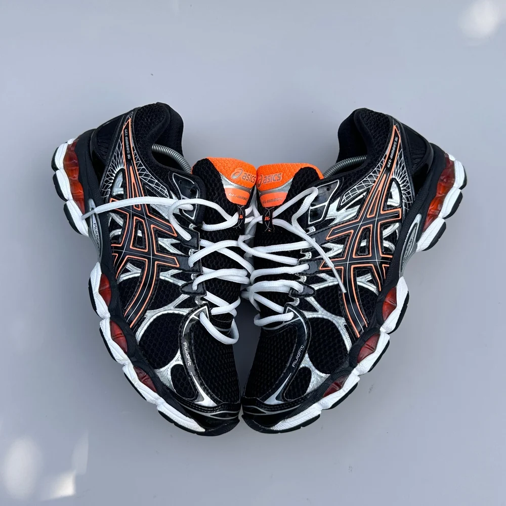 GEL Nimbus 16 — Noir / Orange / Argent